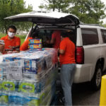 Swaminarayan Vadtal Gadi, SVG-Charity-Donated-1800-pounds-of-food-and-water-to-the-Houston-Food-Bank-By-Vadtal-Dham-Houston-USA-5.jpg